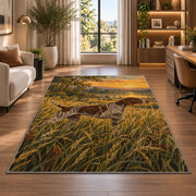 Pointer in Tall Grass at Sunrise rug in a living room with a desk and large windows