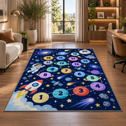 Navy galaxy hopscotch rug with colorful numbered planets, a rocket and astronaut, shown in a sunlit room