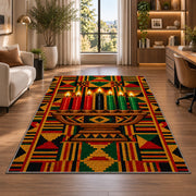 Kente Pattern Kwanzaa Rug in a living room with a desk and large windows