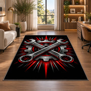 Crossed wrenches and gear rug in a living room with a desk and large windows