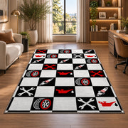 Checkered racing garage rug in a living room with a desk and large windows