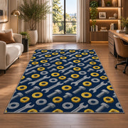 Nuts and bolts pattern rug in a living room with a desk and large windows