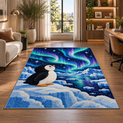 Aurora Penguin Rug in a living room with a desk and large windows