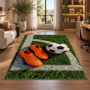 orange soccer cleats and ball rug in a living room with a desk and large windows