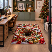 Santa appears above a deep red and green spiral edged with glowing golden lights; rug shown beside a home office desk