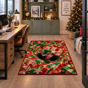 A smiling elf clutches a wrapped present while sitting inside a red and green spiral; rug shown beside a home office desk