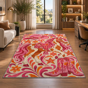 Pink cowgirl rug in a living room with a desk and large windows