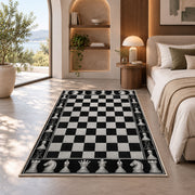 black and white chessboard rug in a bedroom with an arched window