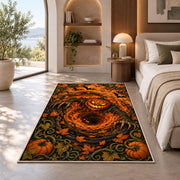 A glowing jack-o-lantern over an orange spiral with pumpkins and curling vines rug in a bedroom beside a window
