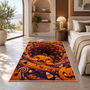 Cute pumpkin and candy spiral area rug in a bedroom beside a window