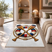 Crossed oars and life ring rug in a bedroom with an arched window