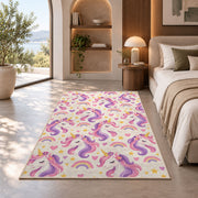 unicorn heads pattern with rainbows rug in a bedroom with an arched window