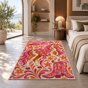 Pink cowgirl rug in a bedroom with an arched window