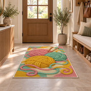 Yarn Balls and Knitting Needles Rug in an entryway with a wooden door and bench