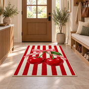 Candy Stripe Cherry Rug in an entryway with a wooden door and bench