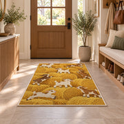 Goats on Hay Bales rug in an entryway with a wooden door and bench