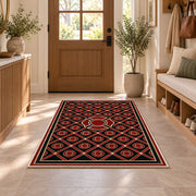 Maltese Cross Lattice rug in an entryway with a wooden door and bench