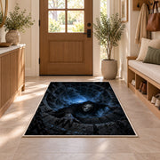 A pale hooded phantom emerging from a blue stone vortex rug in a sunny entryway