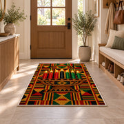 Kente Pattern Kwanzaa Rug in an entryway with a wooden door and bench