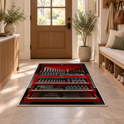 Red toolbox with open drawers rug in an entryway with a wooden door and bench