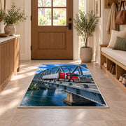 Semi truck crossing a steel bridge rug in an entryway with a wooden door and bench