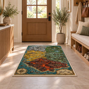 Fantasy island map rug with red volcanic terrain, green forest, and turquoise sea in a sunny entryway