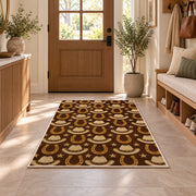 Hats and horseshoes rug in an entryway with a wooden door and bench