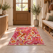 Pink cowgirl rug in an entryway with a wooden door and bench