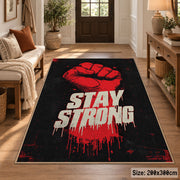 Stay Strong Graphic area rug displayed in a entryway