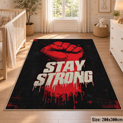 Stay Strong Graphic area rug displayed in a nursery