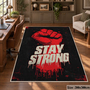 Stay Strong Graphic area rug displayed in a home office