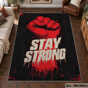 Stay Strong Graphic area rug displayed in a living room