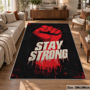 Stay Strong Graphic area rug displayed in a lounge