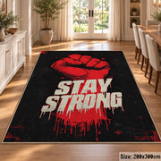 Stay Strong Graphic area rug displayed in a dining room