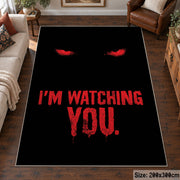 Watching Eyes Typography area rug displayed in a living room