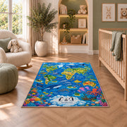 Blue world map rug with ocean animals and colorful coral in a nursery beside an upholstered chair
