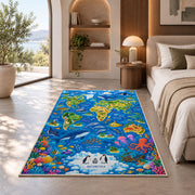 Blue world map rug with ocean animals and colorful coral in a bedroom in sunlight