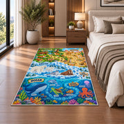 ocean and land wildlife learning map rug displayed in a bedroom beside the bed