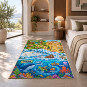 ocean and land wildlife learning map rug displayed in a bedroom in sunlight