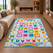 rainbow alphabet and numbers rug displayed in a living room with a fireplace