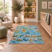 animal world map alphabet rug displayed in a nursery beside an upholstered chair