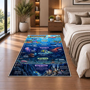 ocean zones exploration rug displayed in a bedroom beside the bed