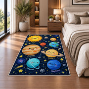 smiling planet solar system rug displayed in a bedroom beside the bed