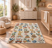 pastel alphabet objects rug displayed in a nursery beside a crib
