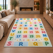 pastel alphabet number grid rug displayed in a living room with a fireplace