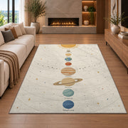 pastel planet orbit learning rug displayed in a living room with a fireplace