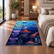 ocean depths marine creatures rug displayed in a bedroom beside the bed