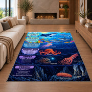 ocean depths marine creatures rug displayed in a living room with a fireplace
