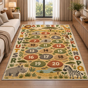 safari alphabet number trail rug displayed in a sunlit lounge beside a sofa