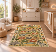 safari alphabet number trail rug displayed in a nursery beside a crib